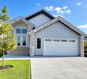 Modern home entrance flanked by young tree